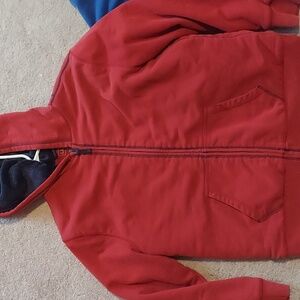 Blue fur lined red zip sweatshirt.